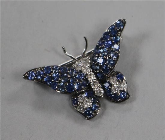 A modern 18ct white gold, sapphire and diamond set butterfly brooch, diameter 26mm.